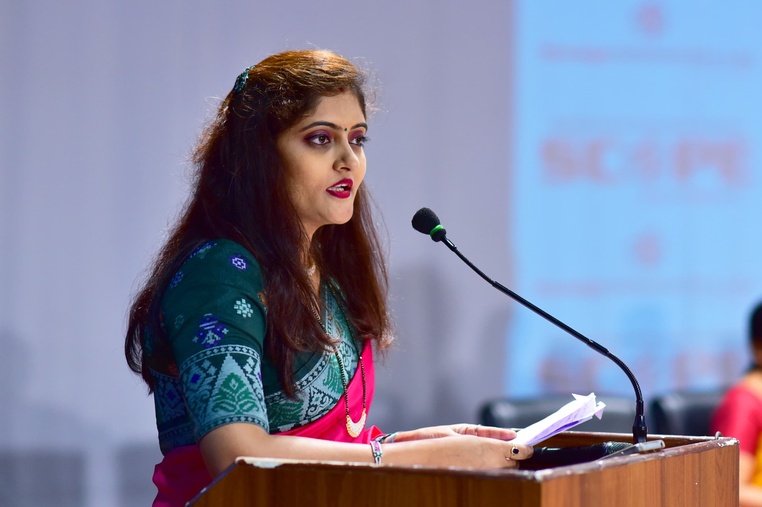 Sonali Gorade of Sumago Infotech speaking at a podium