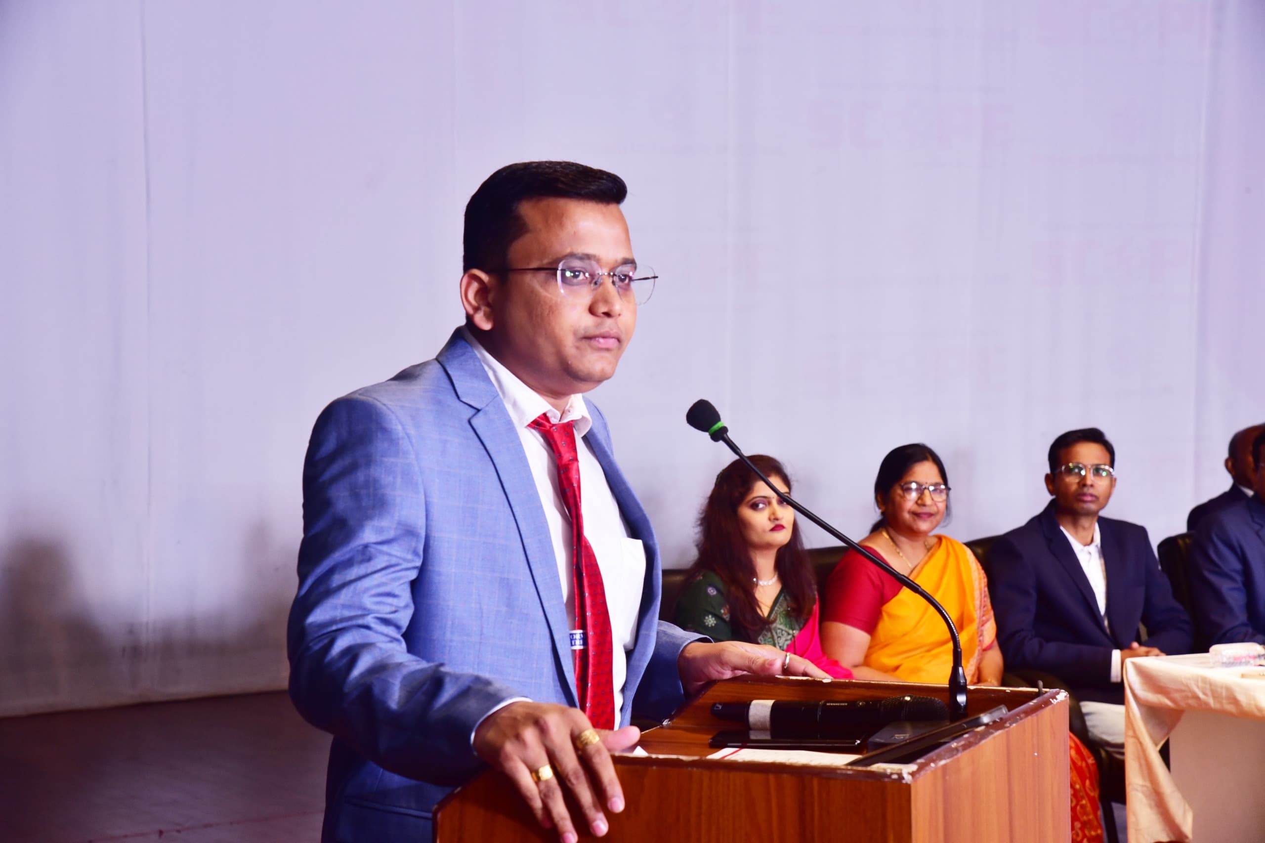 Sudhir Gorade of Sumago Infotech speaking at a podium