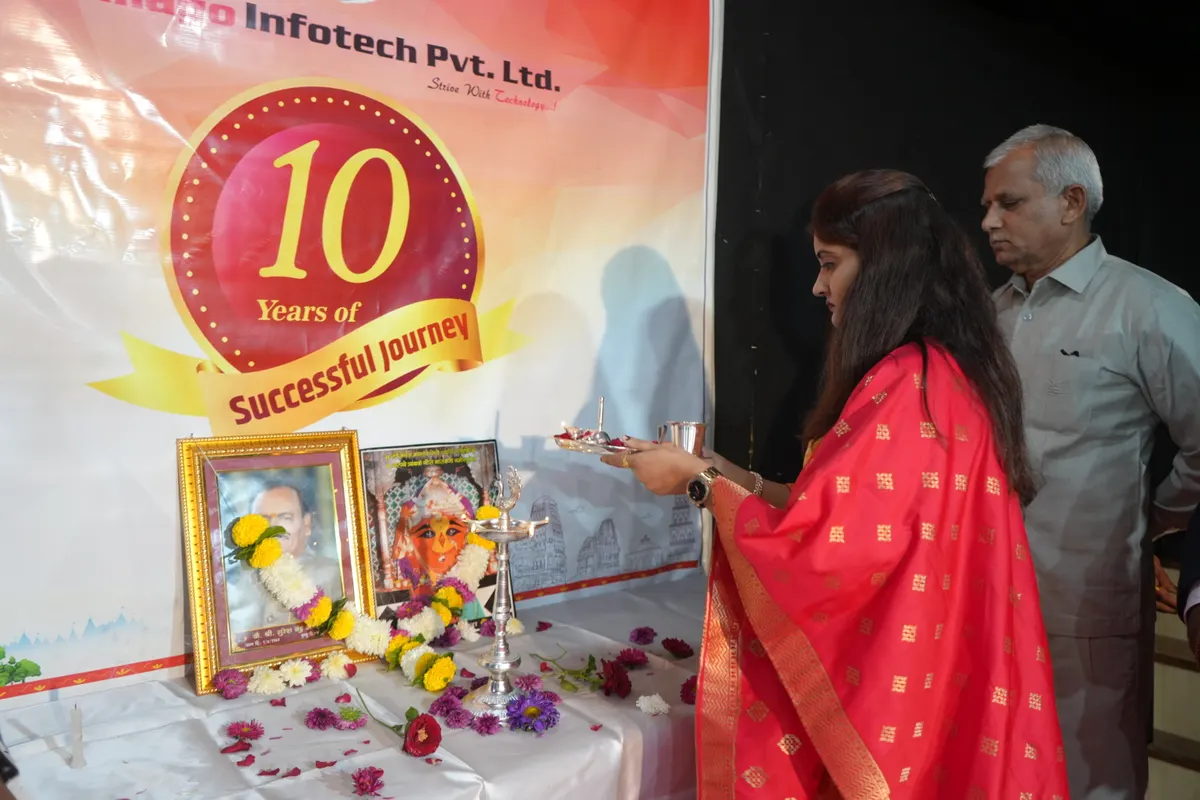 Lighting the lamp at Sumago's tenth-anniversary celebration