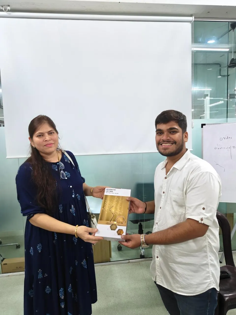A participant receiving their award at the Gemma hackathon