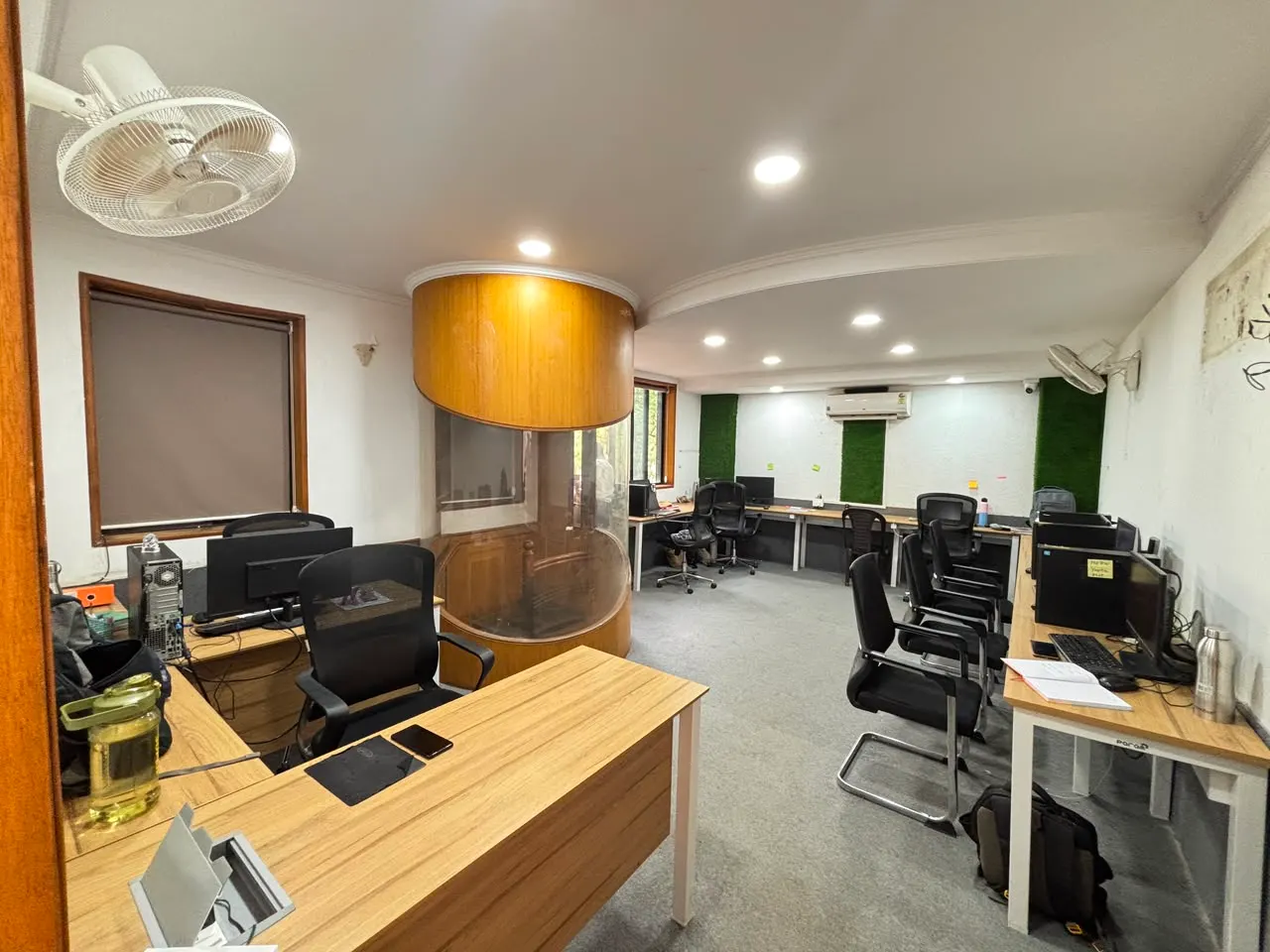 Workstations and a discussion pod on Sumago's office floor