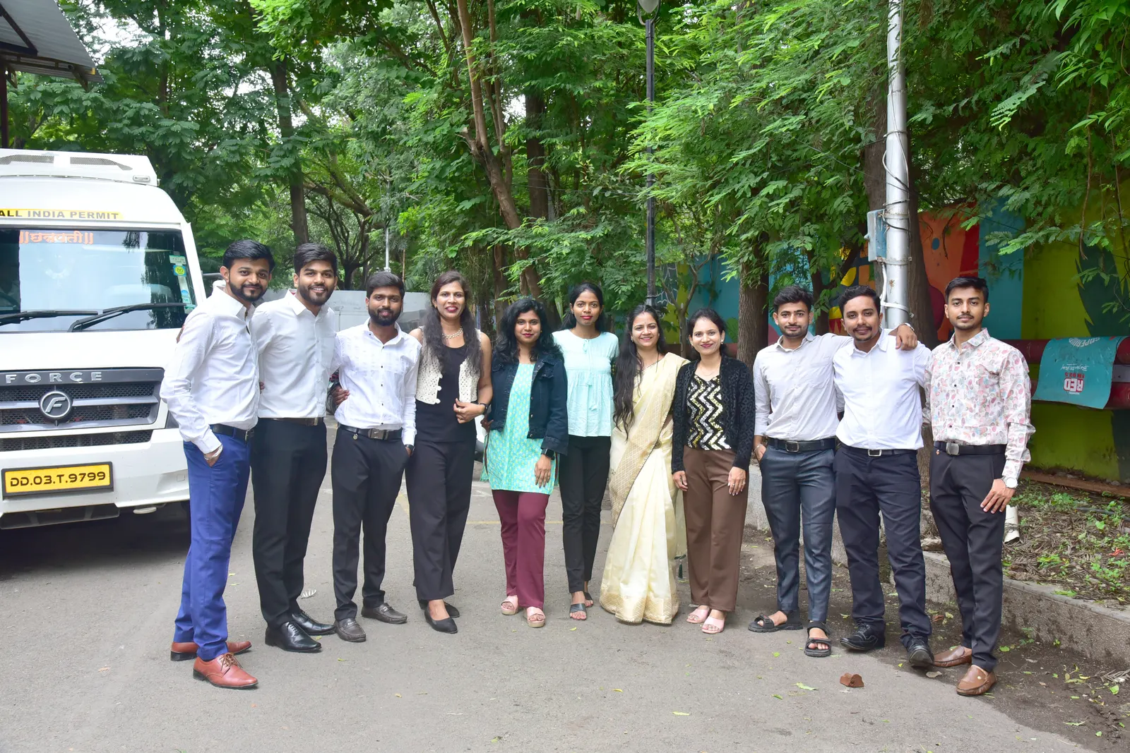 The Sumago team gathered outdoors at the office